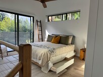 Cozy quiet bedroom and a beautiful bathroom upstairs. It also has a big terrace with chairs.