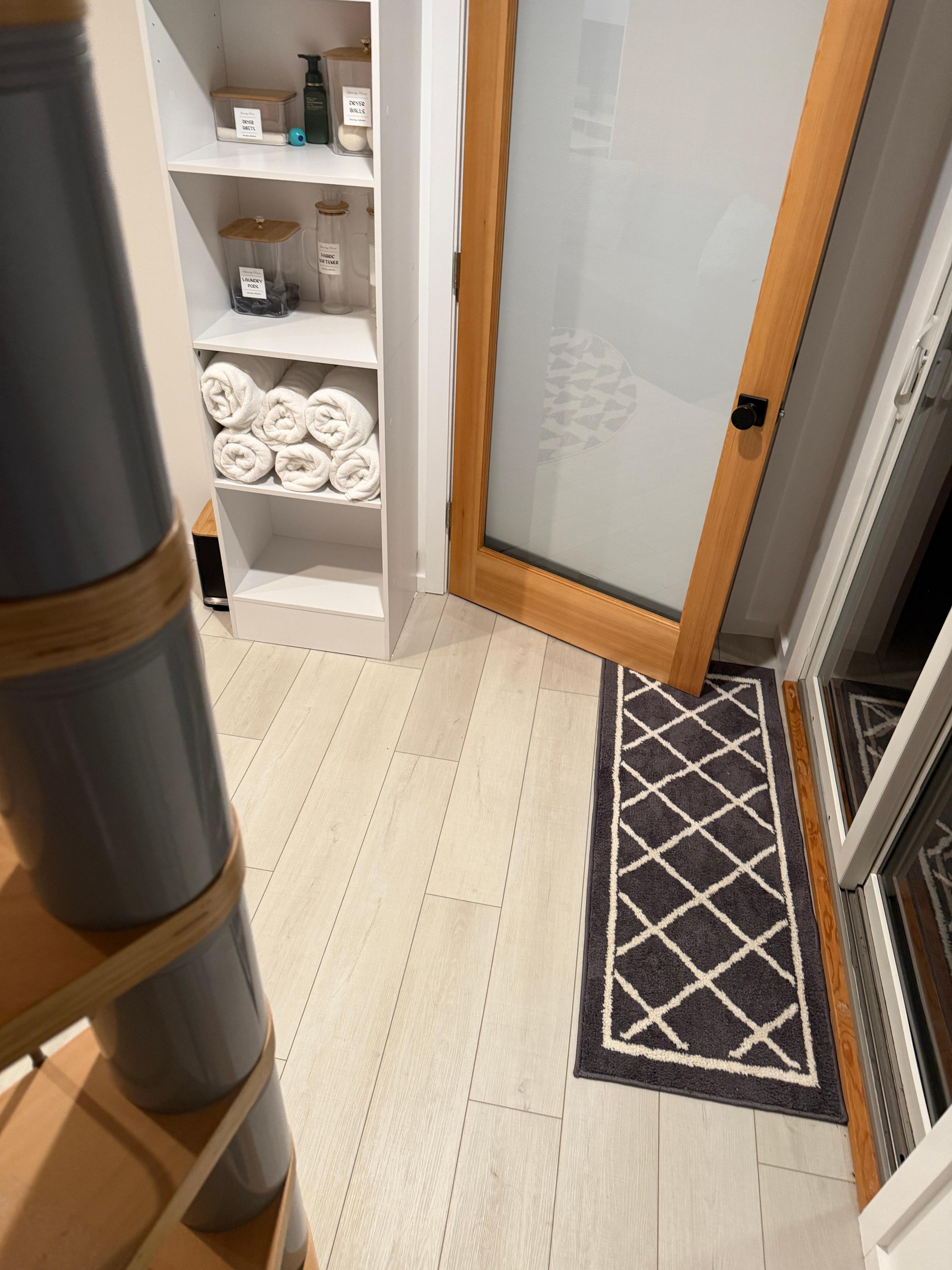 Door to the bedroom accessed through the laundry room.