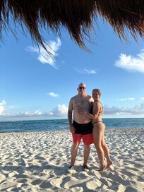 My husband and I enjoying the sun, sand and the amazing view in the beach