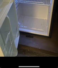 The fridge and the floor was dirty