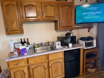Ancient microwave and toaster oven. Kitchen drawers fall when pulled out