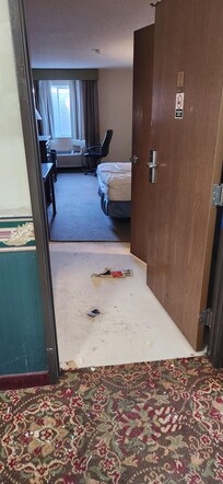 This room across from our room door remained open for our entire stay. Trash on the floor, no attempt by anyone to clean up.