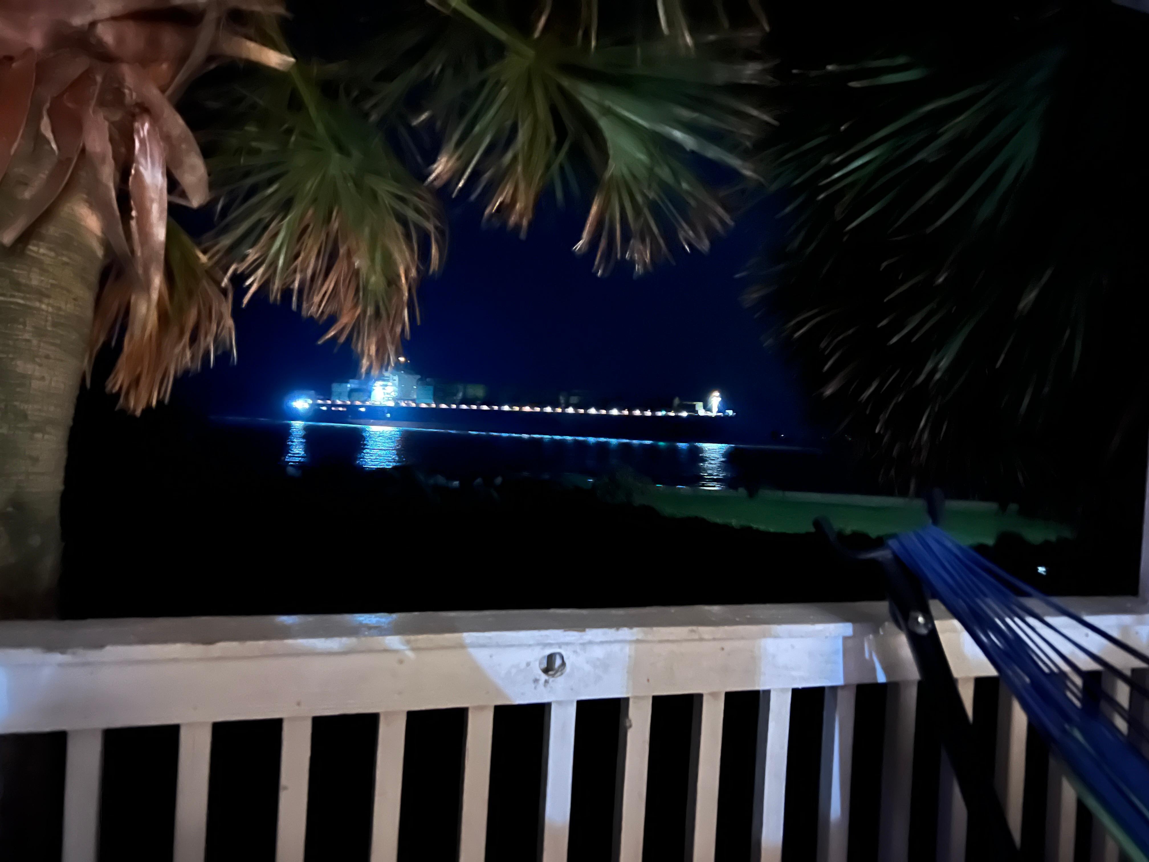View at night from the porch. Watching a passing barge.  