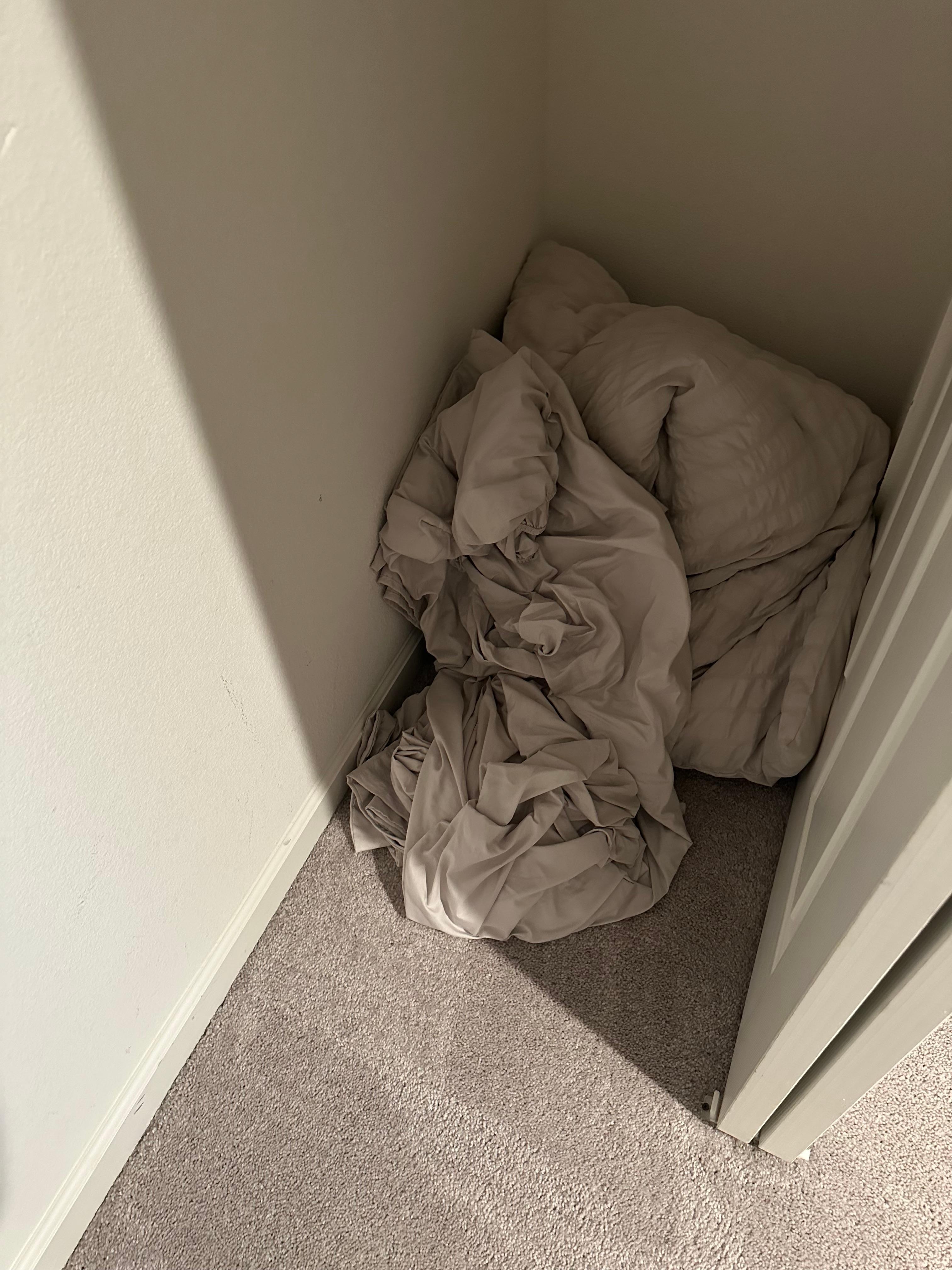 Linen balled up on the floor 