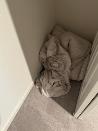 Linen balled up on the floor