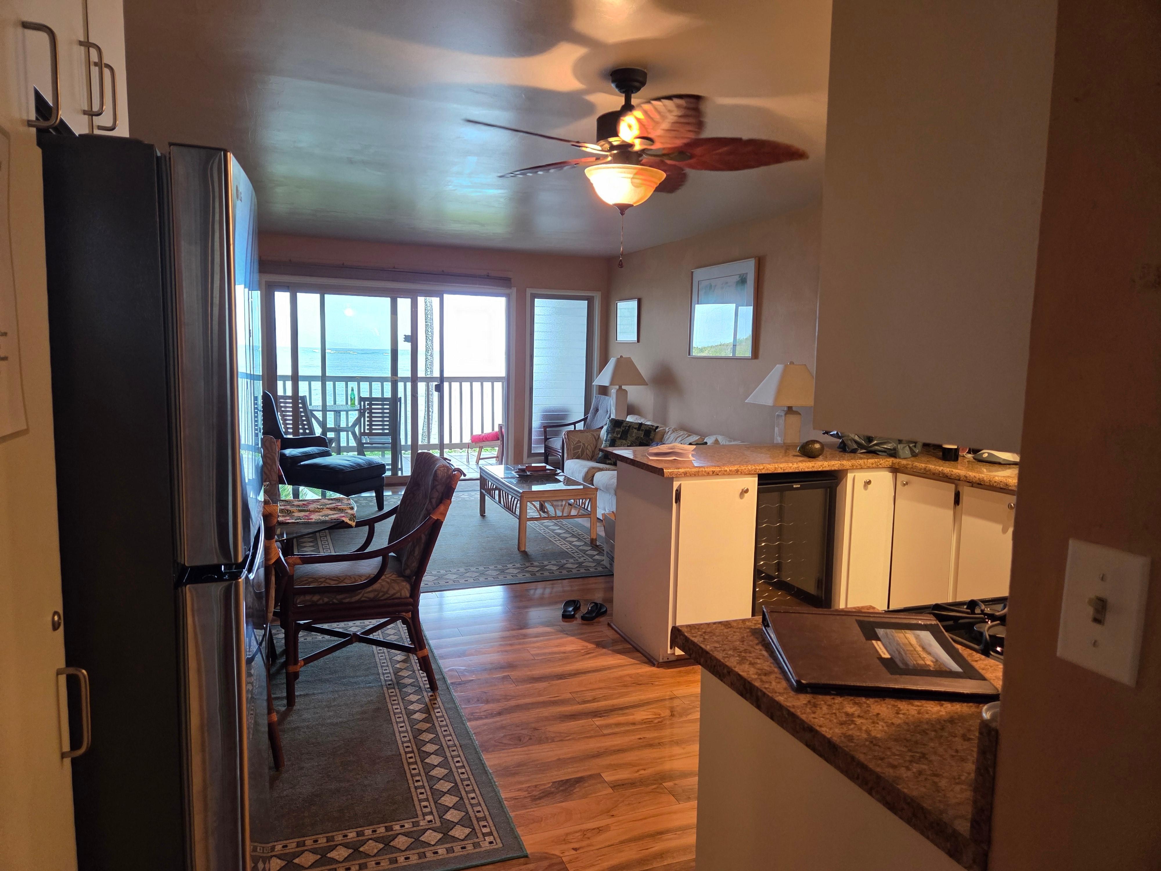 View of the kitchen and living area. Yes that's a wine fridge.