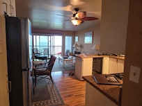 View of the kitchen and living area. Yes that's a wine fridge.