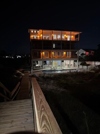 Beautiful night view of the house from the beach