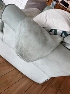 Armrest on the den chairs to dirty to wear a white shirt and sit down.