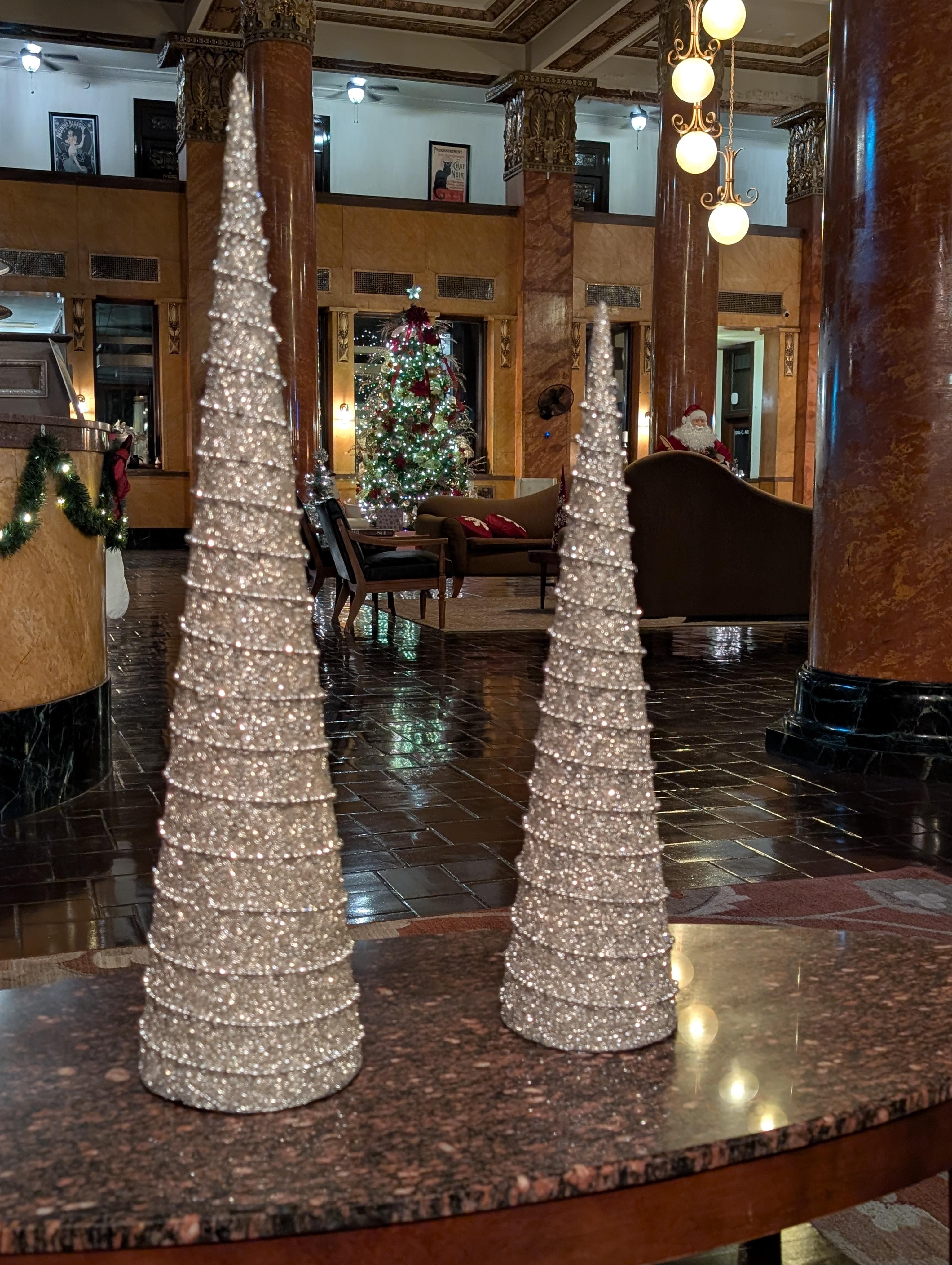 View of huge Christmas tree in lobby.