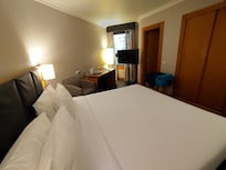 Very small window, hence quite dark roomn