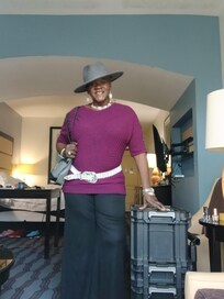 Me in the living room area, I love how spacious the room was as well as the arch design as a divider.