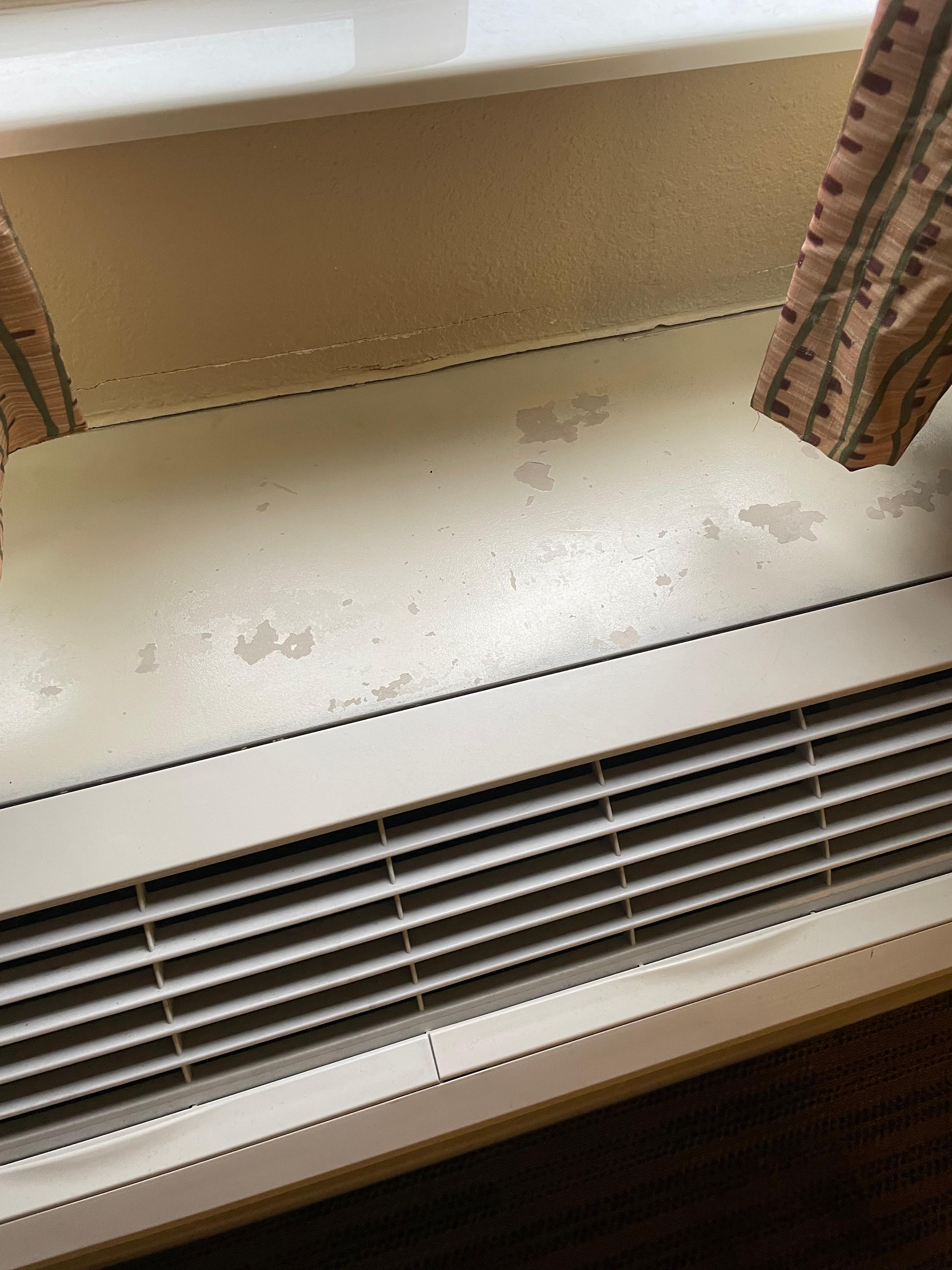 Broken heater with multiple stains. 