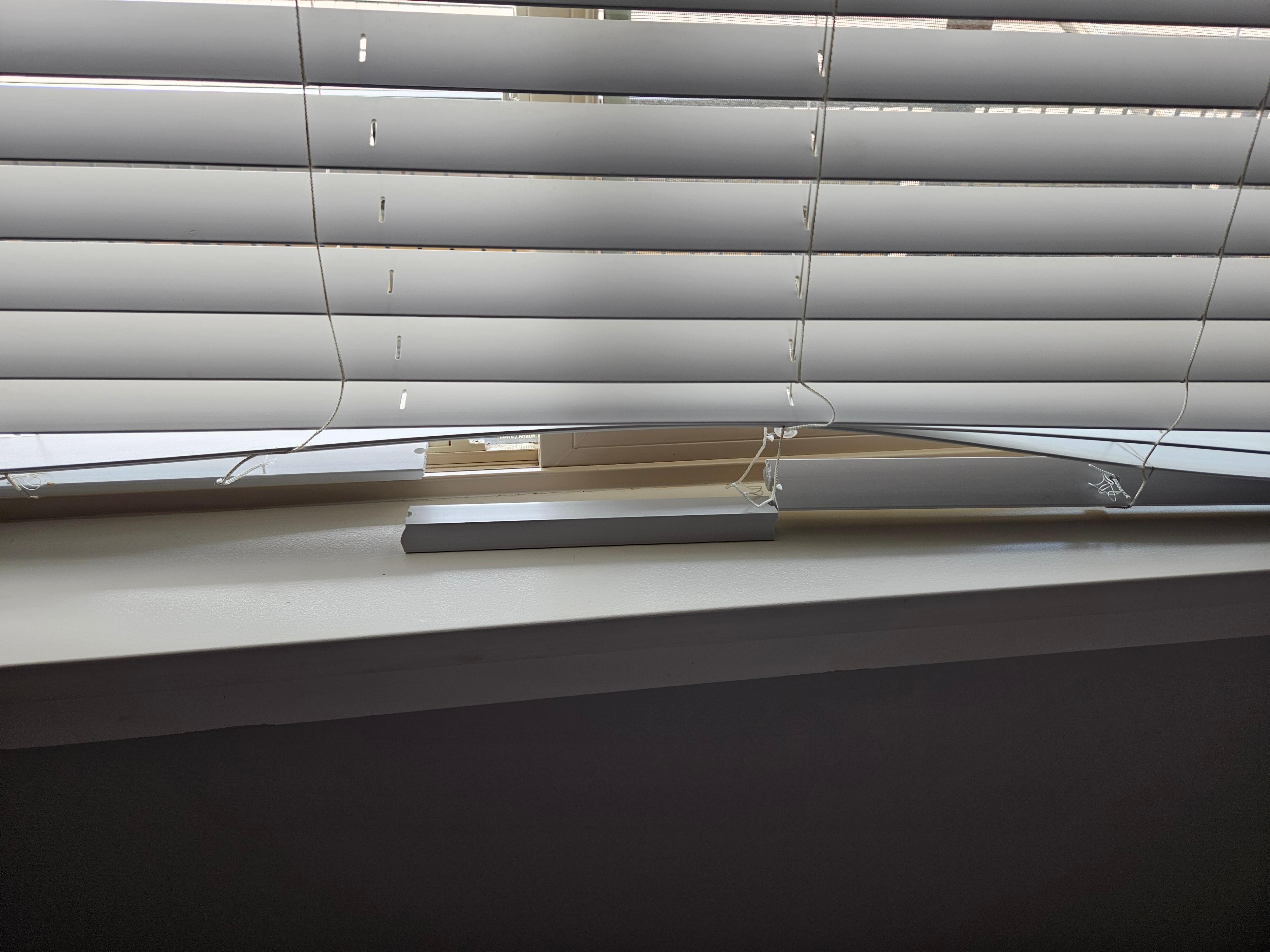 Bottom of blinds was severed in two places in one bedroom