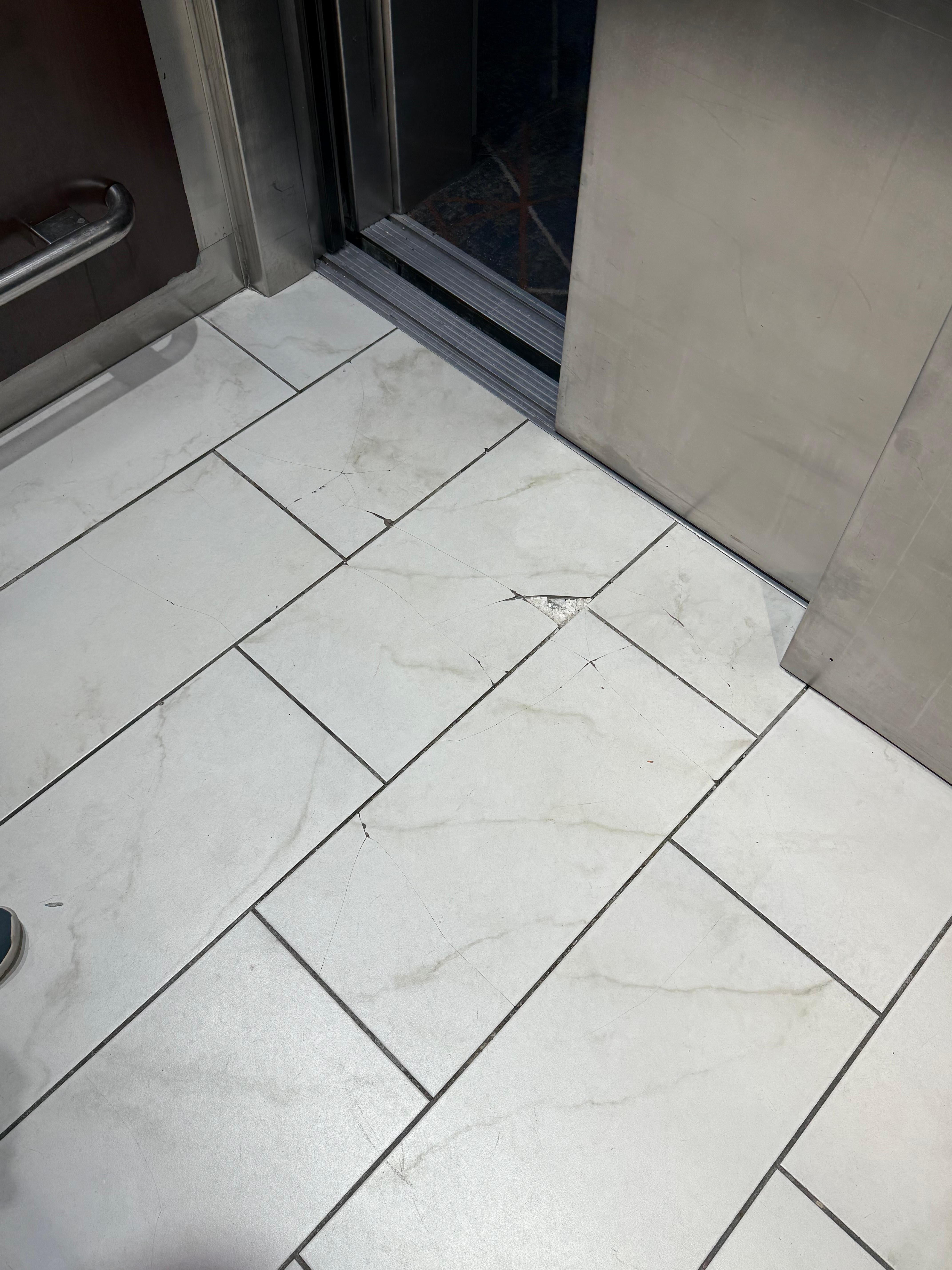 Tile condition in the only elevator in the whole place. 