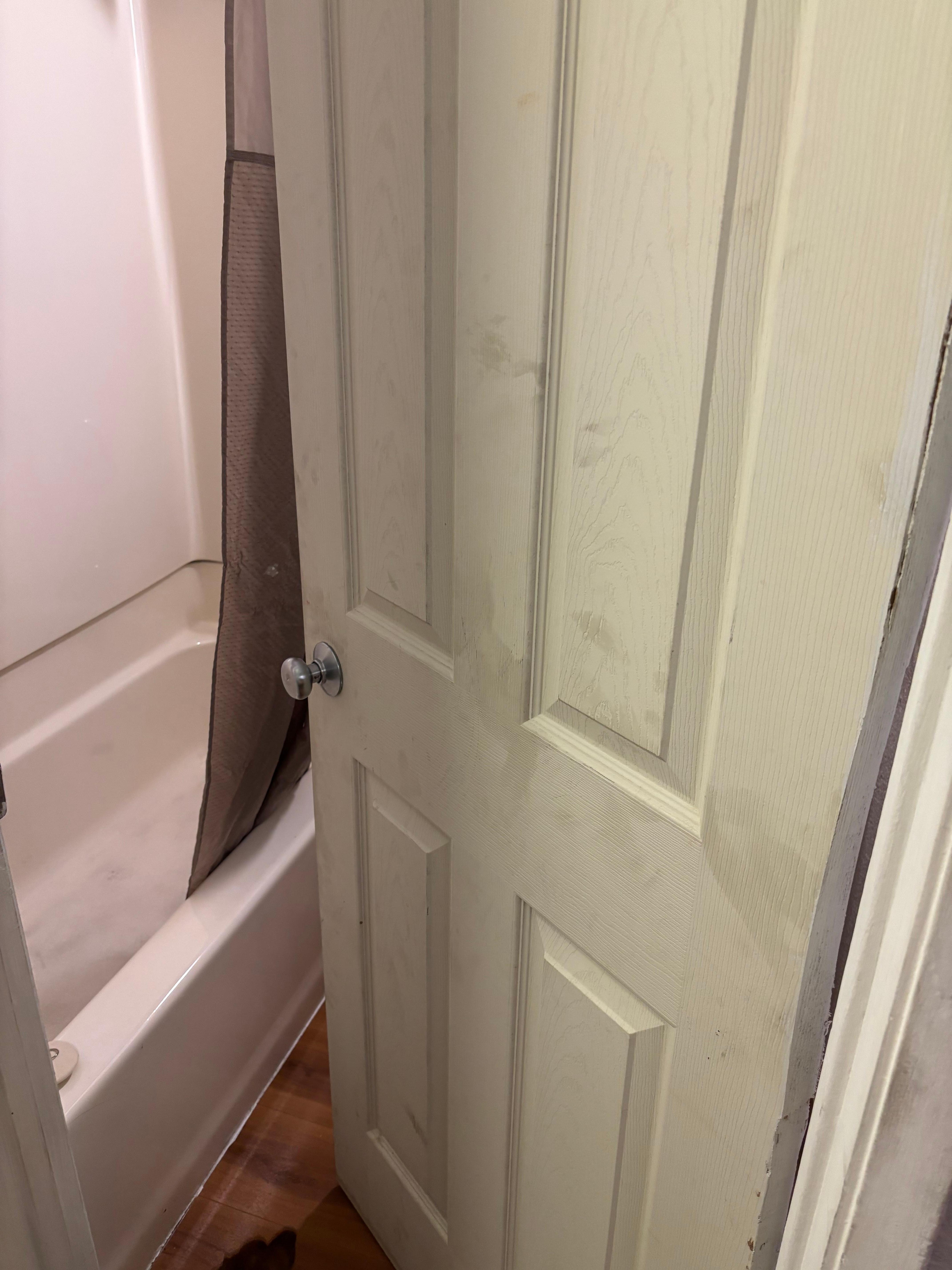 Dirty bathroom door. 