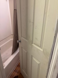 Dirty bathroom door.