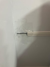 to the left of the queen bed in the loft was "repaired"with packing tape