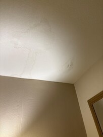 Stains, cracks, poor repair job on ceiling