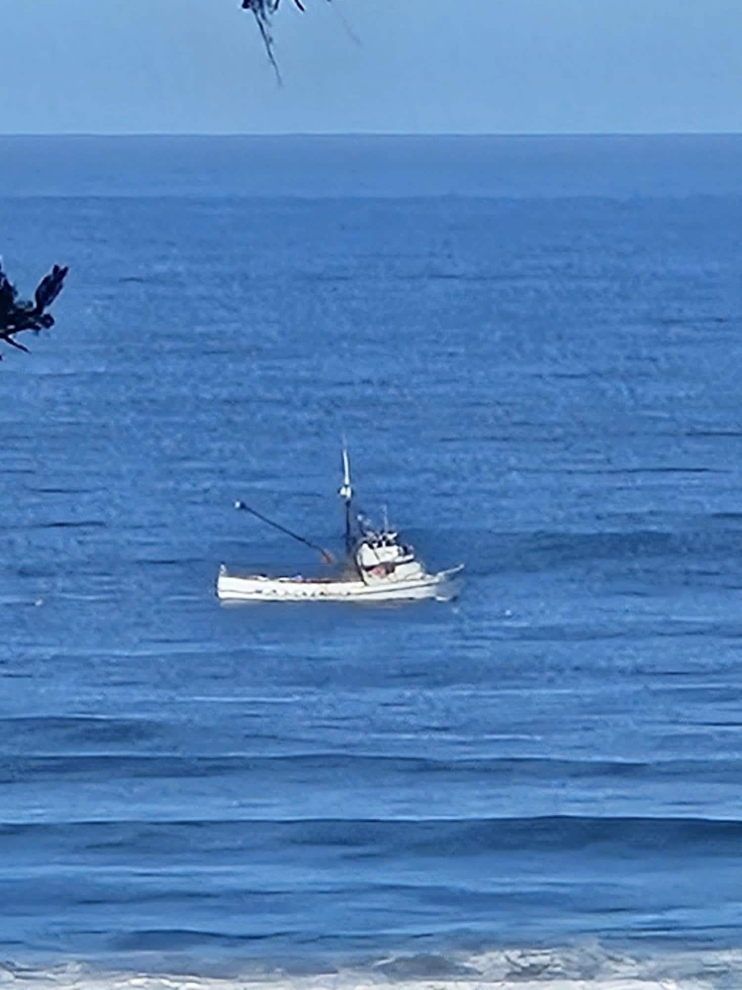 Fishing boat off the coastline.