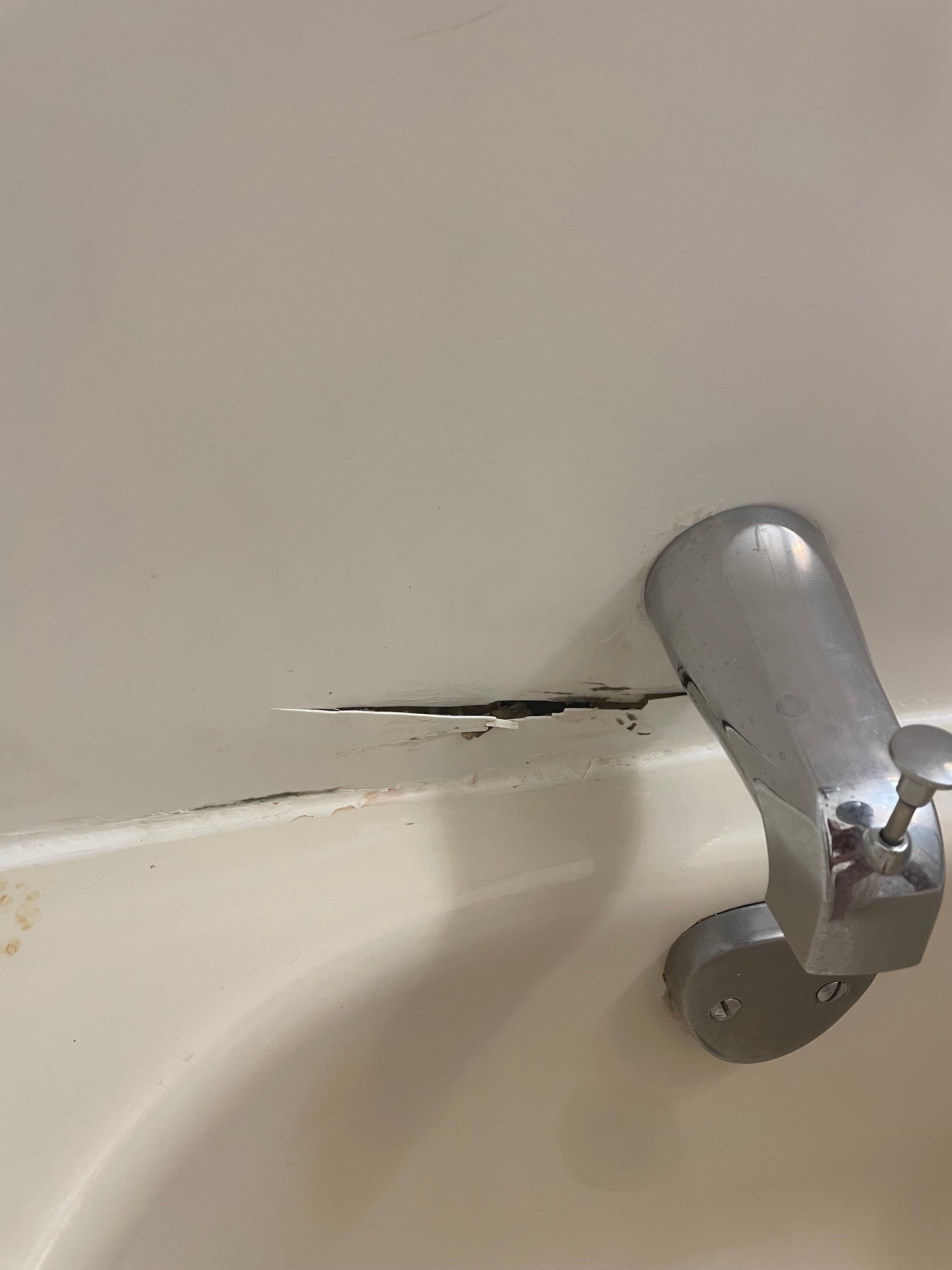 The crack in the tub surround will probably eventually let water in to cause mildew.