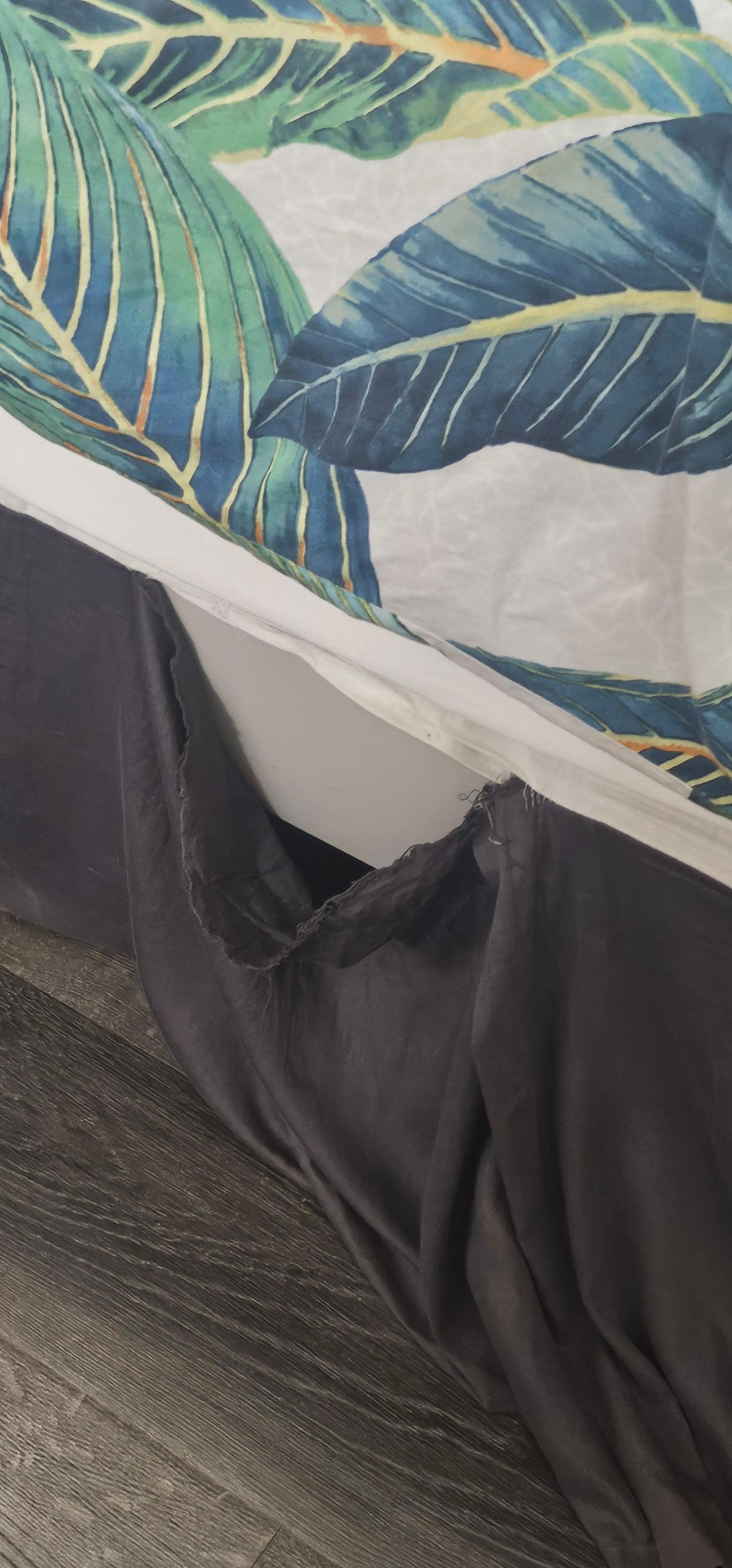 Torn bed skirt. 