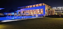 Beach side of hotel lit up at night