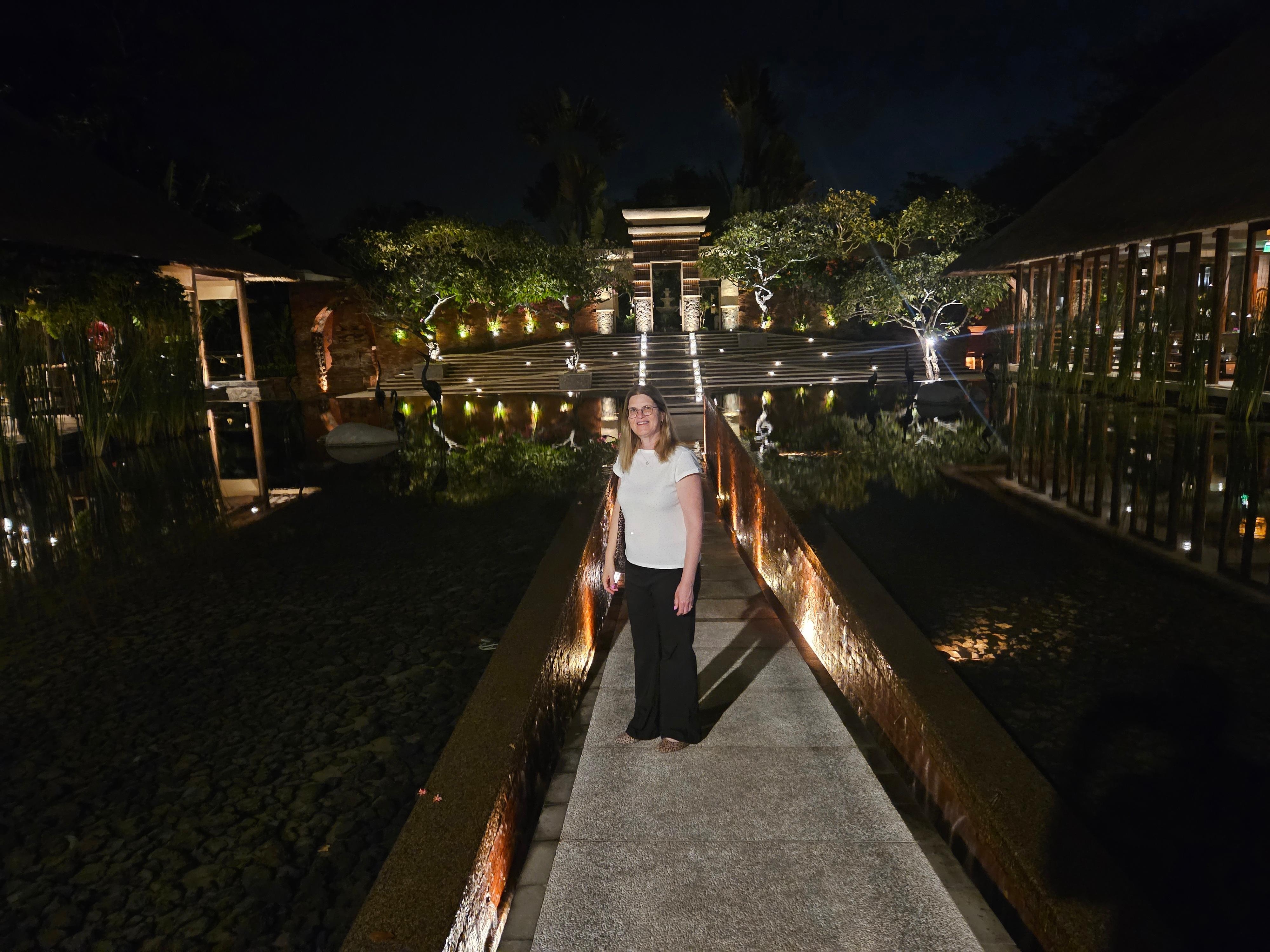 Hotel entrance with infinity pools at night
