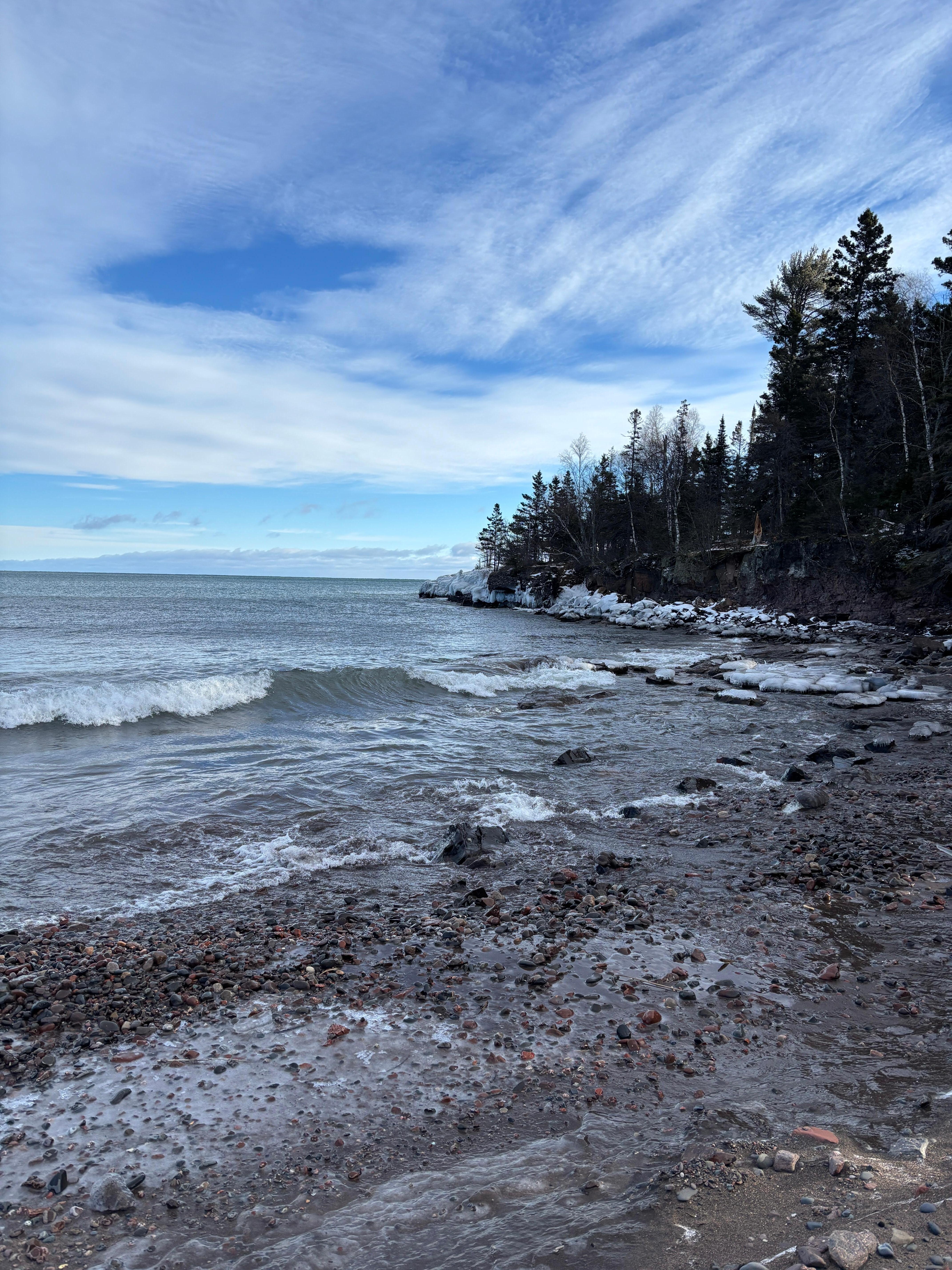 Walk down short trail across the street to sandy Lake Superior beach.