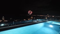 Night fireworks from pirate ship on top of roof