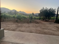 Beautiful sunsets surrounded by mountains and vineyards.