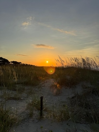 Sunrise standing on the path to the ocean.