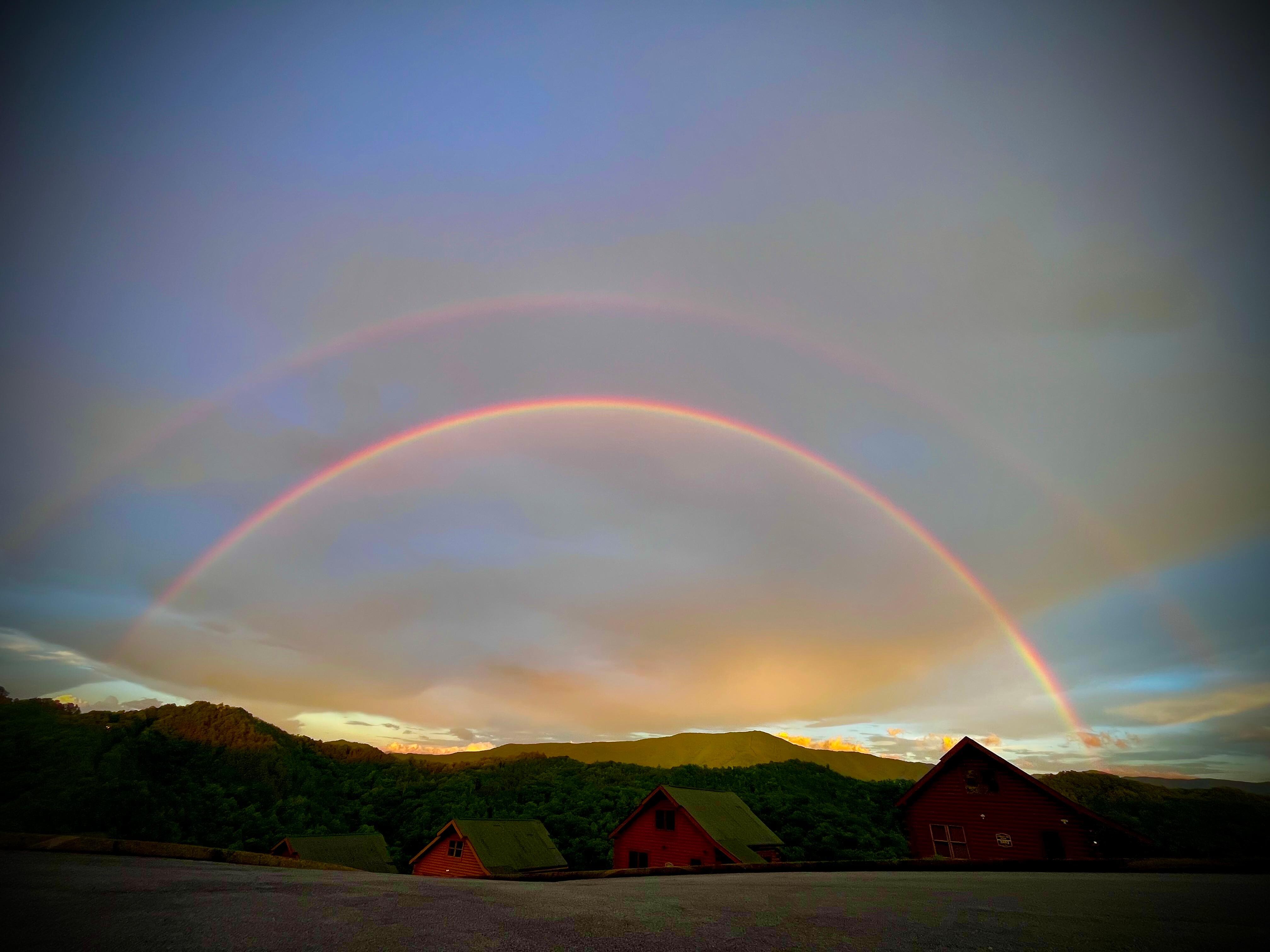 Double rainbow right over our cabin. Saw a faint rainbow from the kitchen table and walked out to view and find how beautiful it really was. 
