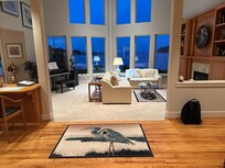 Sunken living room with gas log fireplace.