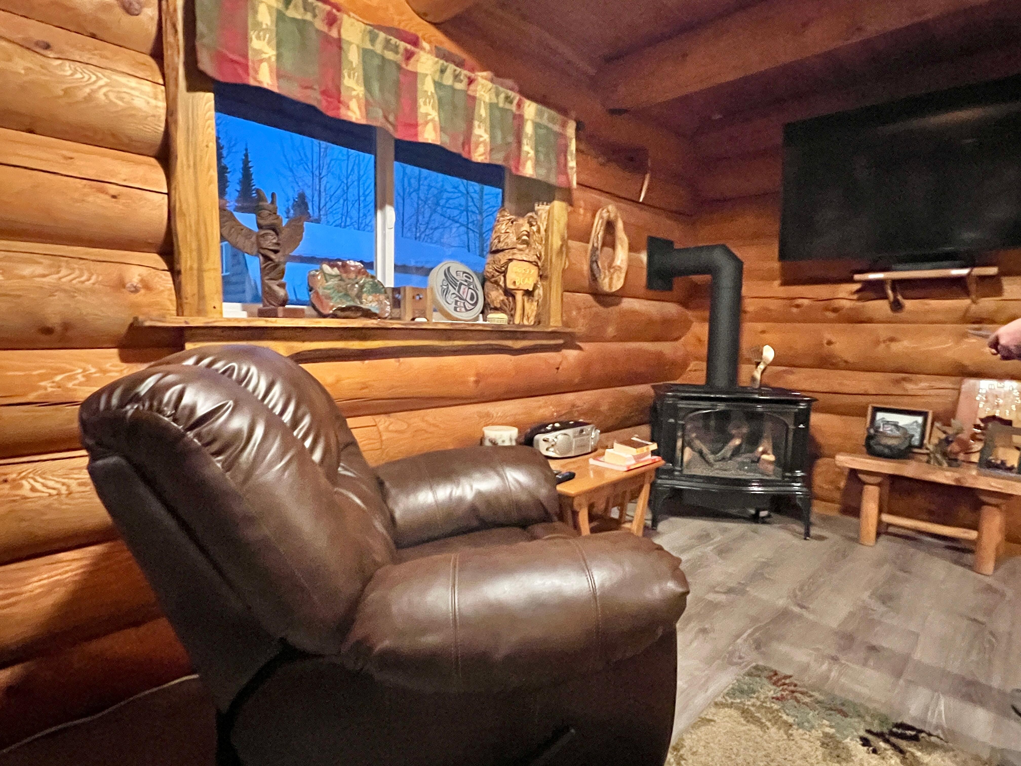 Gas fireplace, leather recliner and couch
