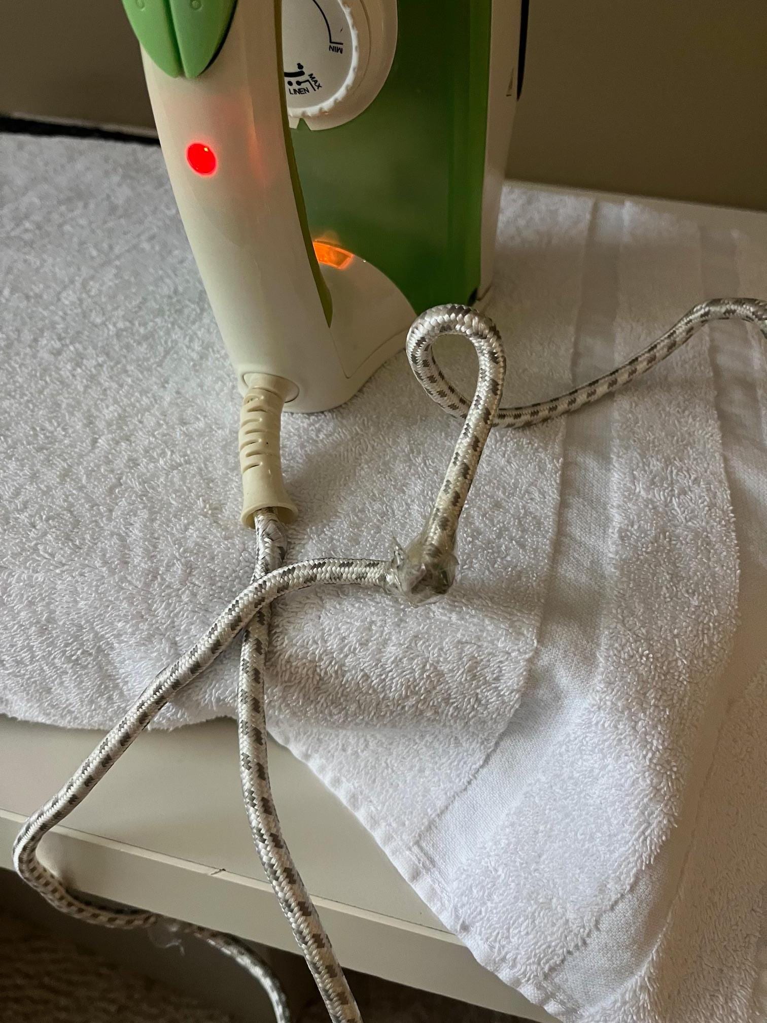 Power cord held together with sticky tape