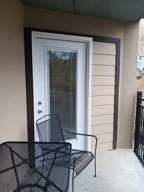Balcony door leading to bedroom