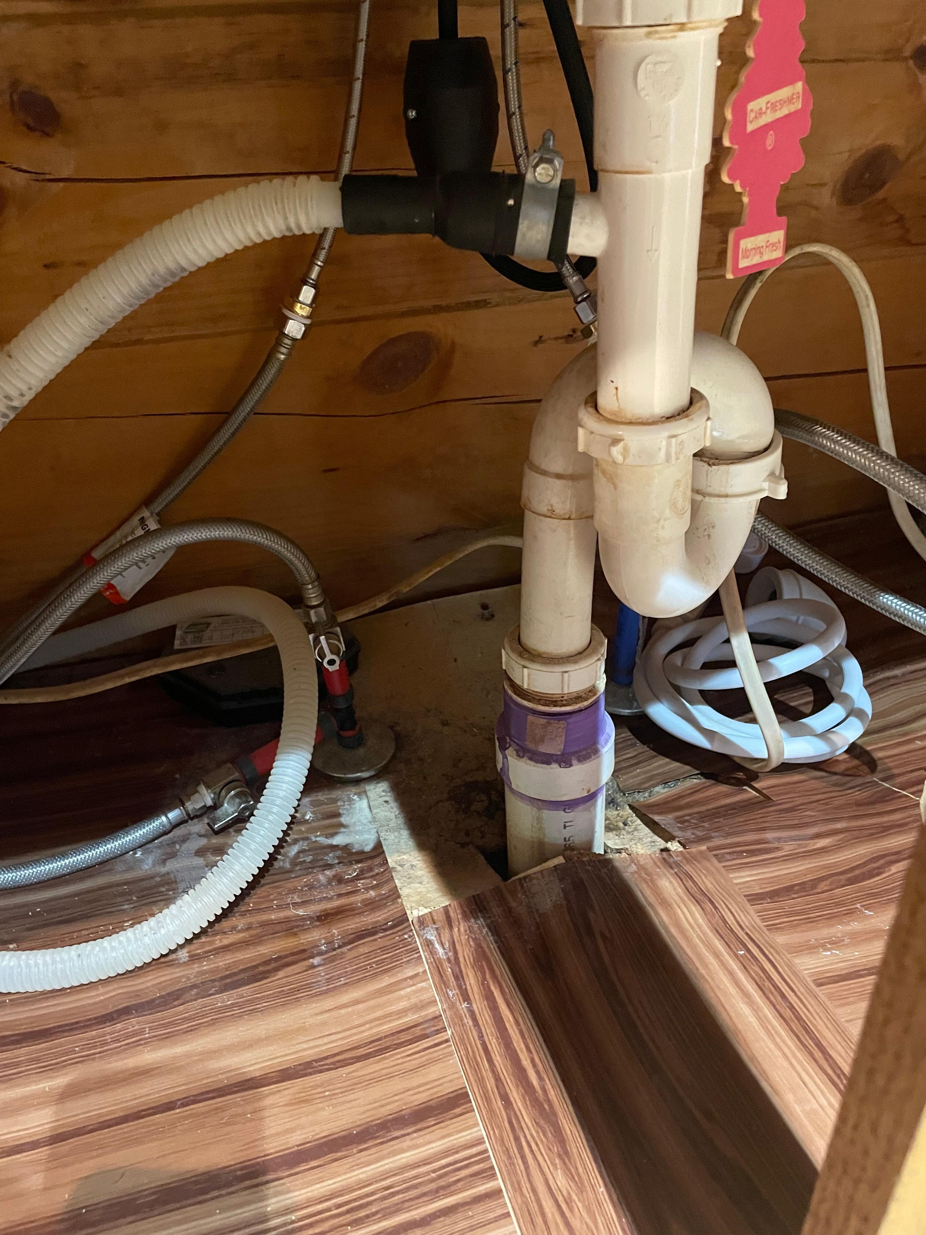 Under sink in kitchen 
