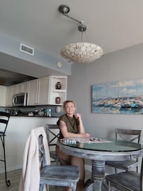 Relaxing while painting and enjoying listening to music with views of the clear turquoise water.