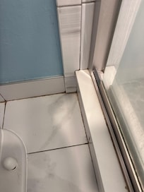 Dirty floor behind the toilet