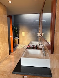 outdoor / indoor bathroom with a bathtub