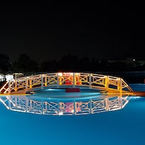The bridge over the pool at night