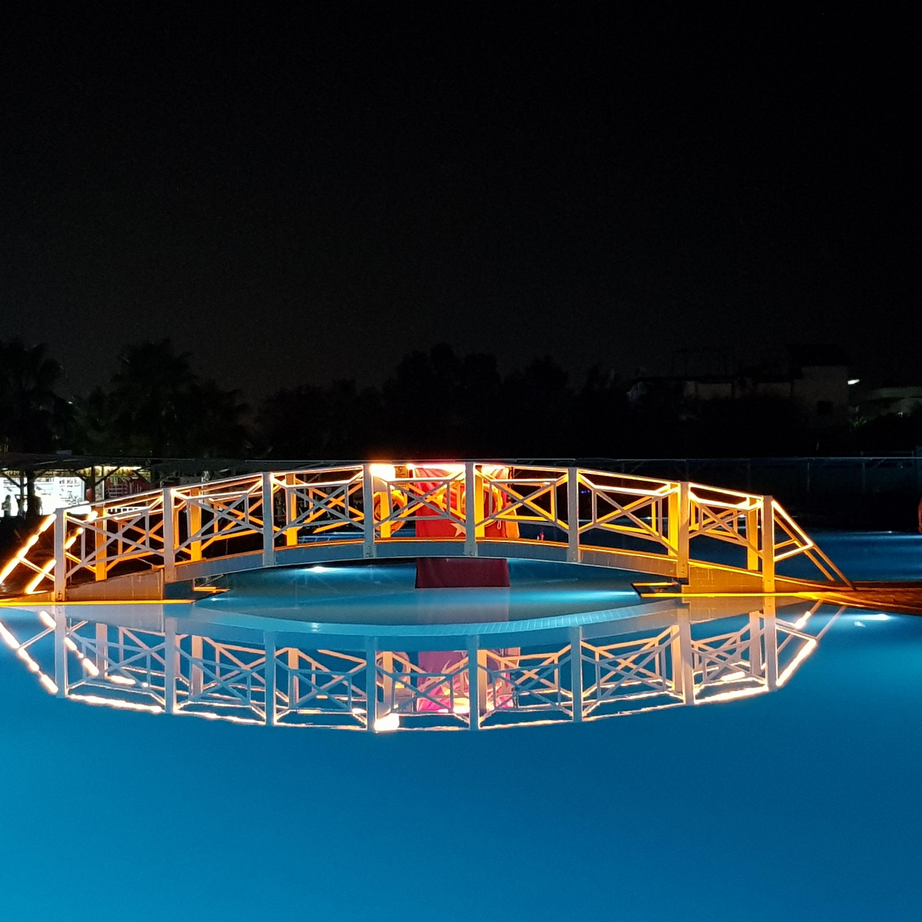 The bridge over the pool at night