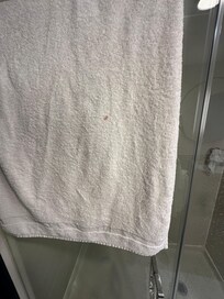Someone else’s blood on my towel in my faucet