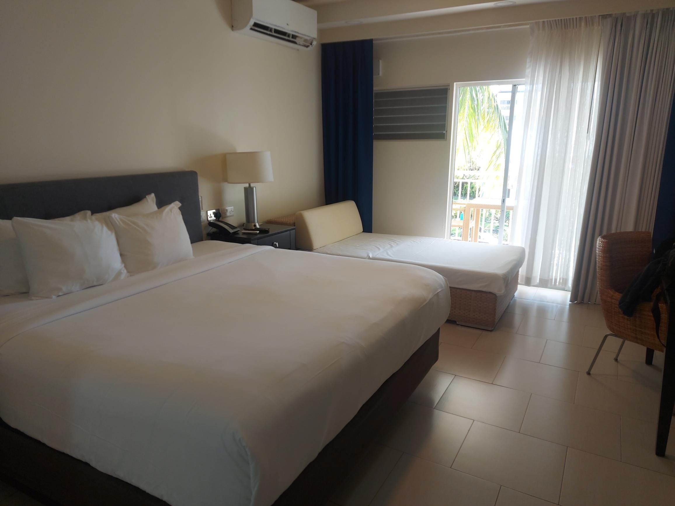Inside the room - we had to move that day bed (can be split) to be able to access the balcony!