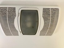 Fan in bathroom- covered in dirt