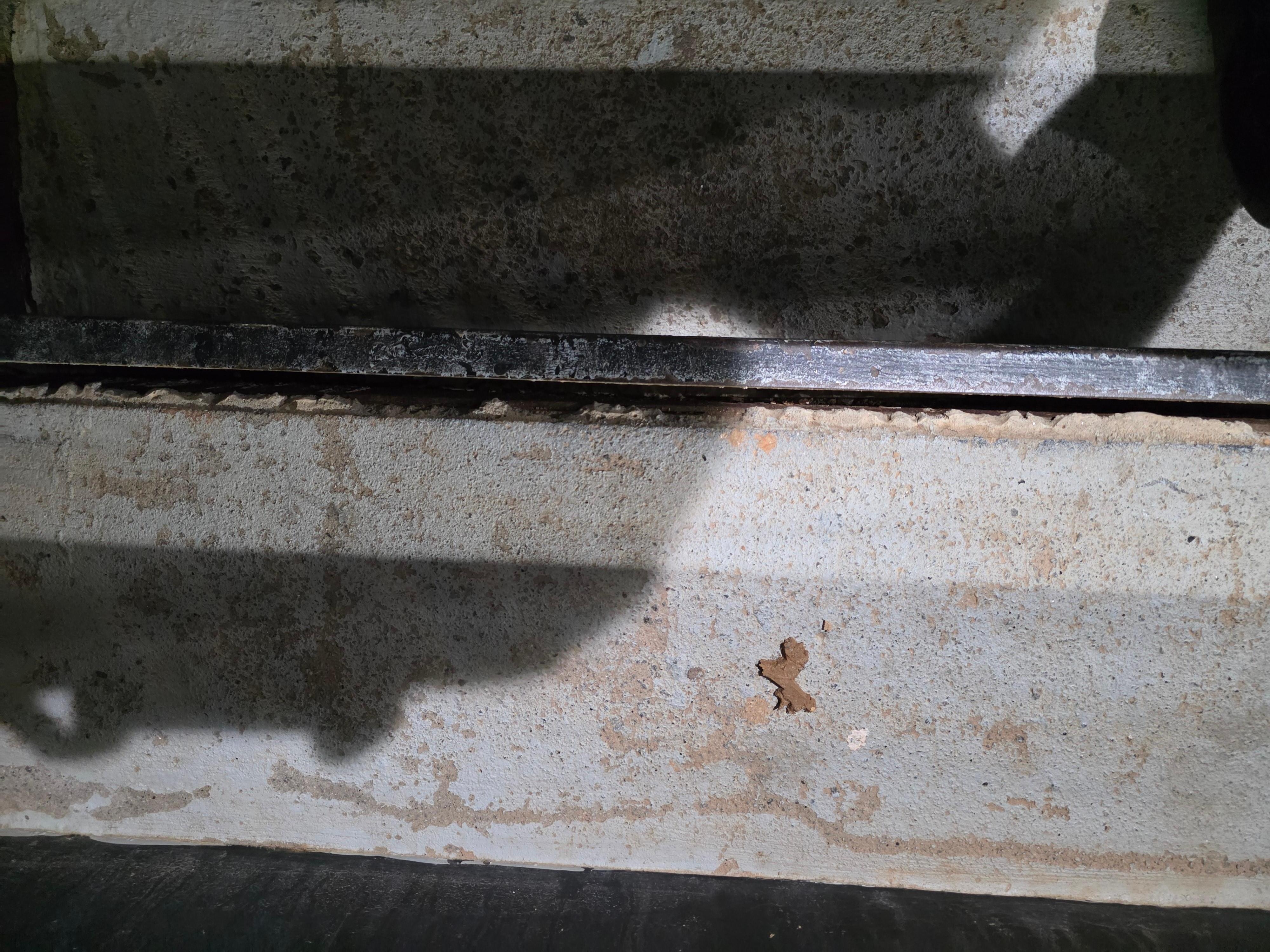 outdoor stairs to get to 2nd floor, gap between concrete and metal