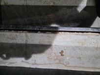 outdoor stairs to get to 2nd floor, gap between concrete and metal