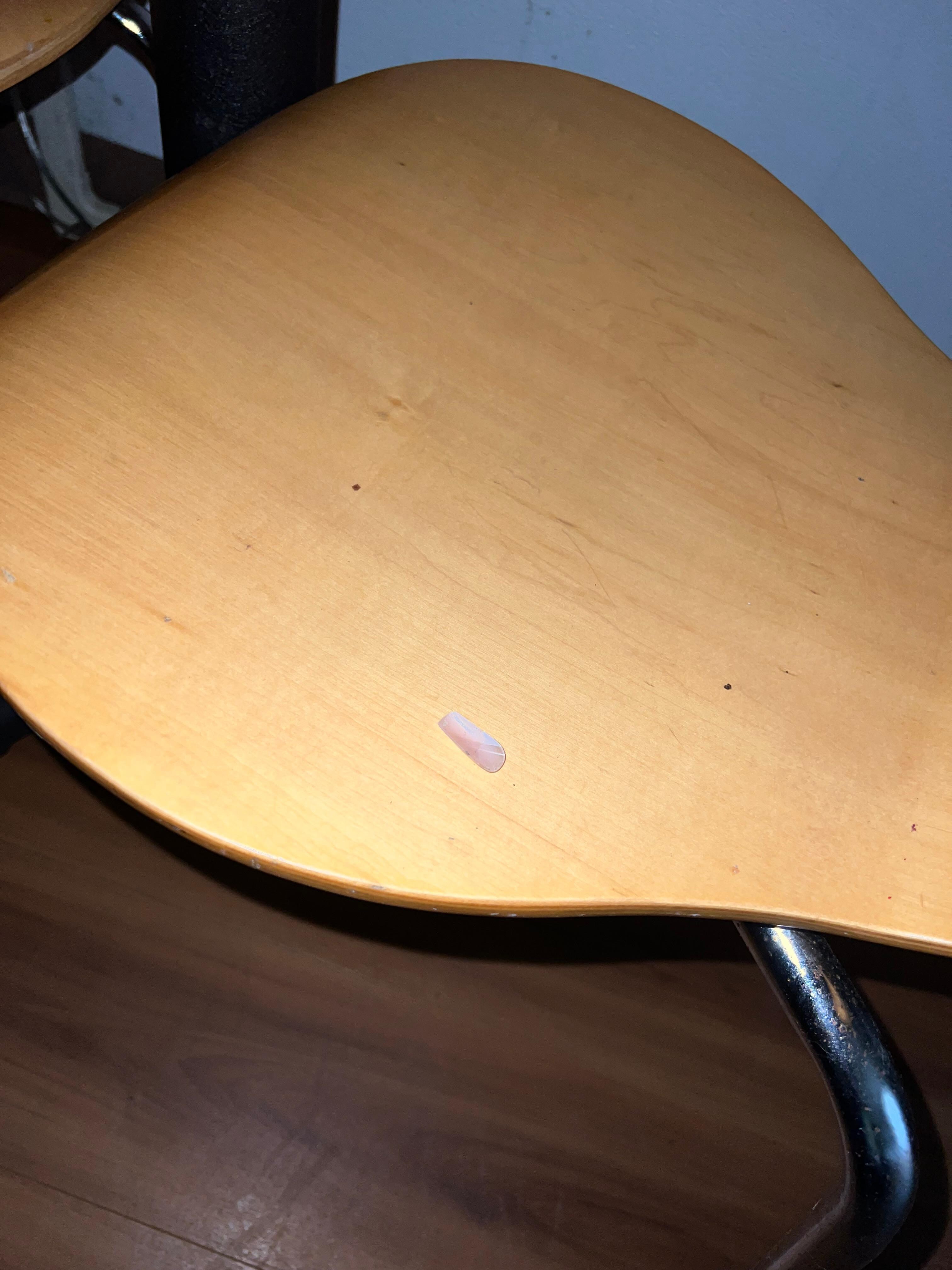 Fake fingernails left about the room. 