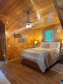 Comfortable Bed and bathroom right across from it and it’s so cute !